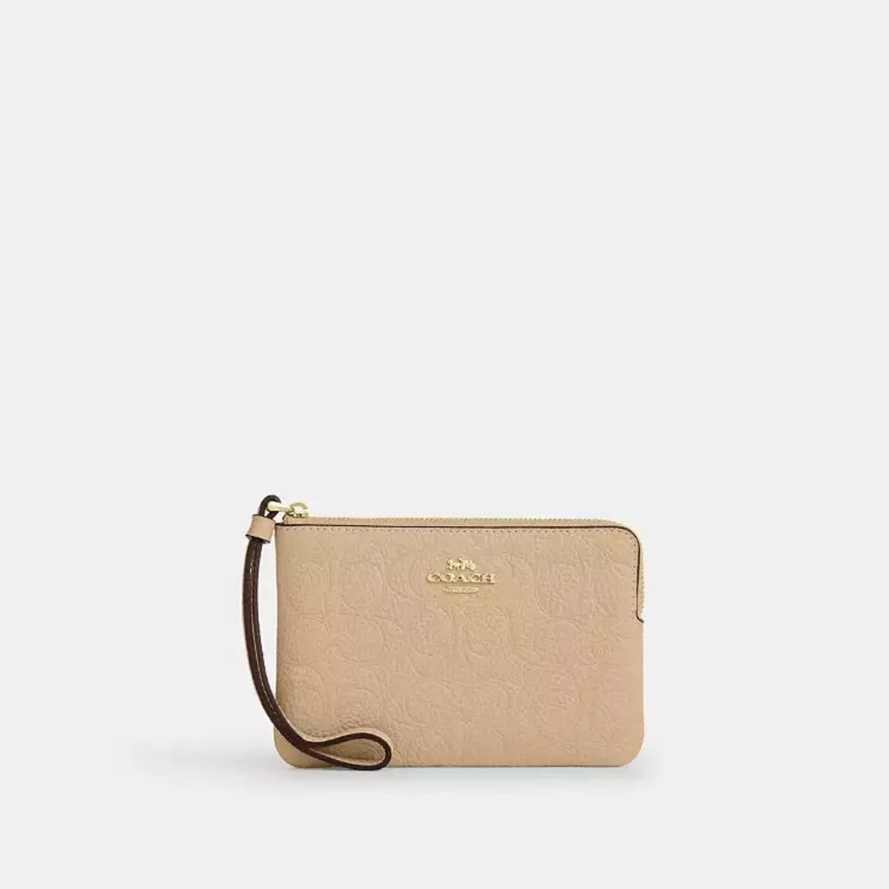 Coach Embossed Cream Wristlet - Picture 2 of 5